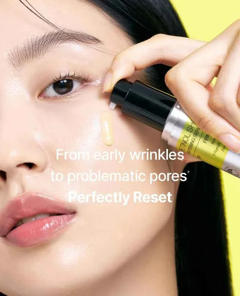 Woman applying Korean skincare serum to face, showcasing Amora Skin K-beauty product benefits.
